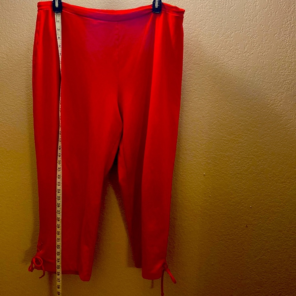 WOMENS Red pants with lace up ties on the leg bottom (size equivalent to a 16w)